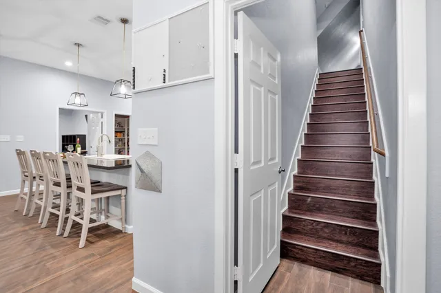 a view of kitchen and dining room with wooden floor