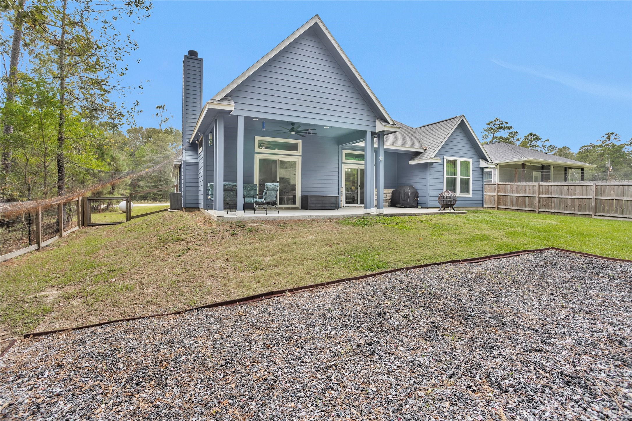 1057 Magnolia Point Drive Huffman, TX 77336 - Photo 41 of 48 There is a grass free area for a garden in spring or fall