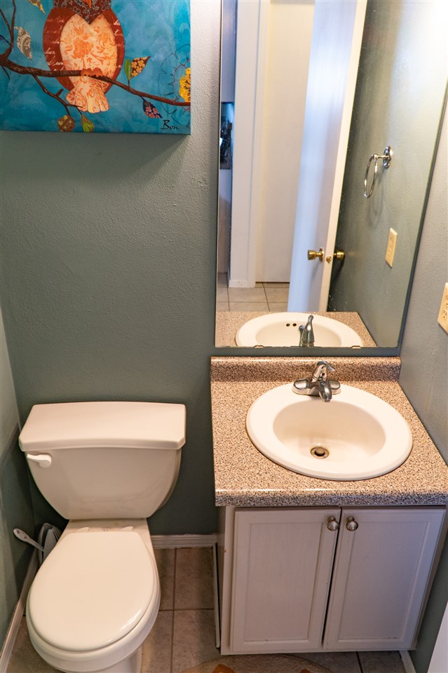696 Bayfield Road Rockton, IL 61072 - Photo 11 of 20 a bathroom with a toilet sink and mirror