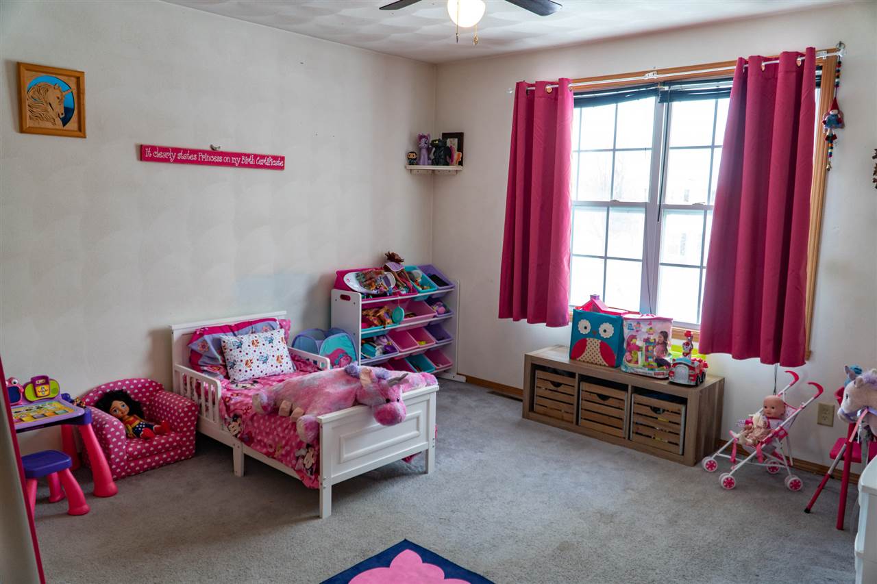 696 Bayfield Road Rockton, IL 61072 - Photo 17 of 20 a bedroom with furniture and a window