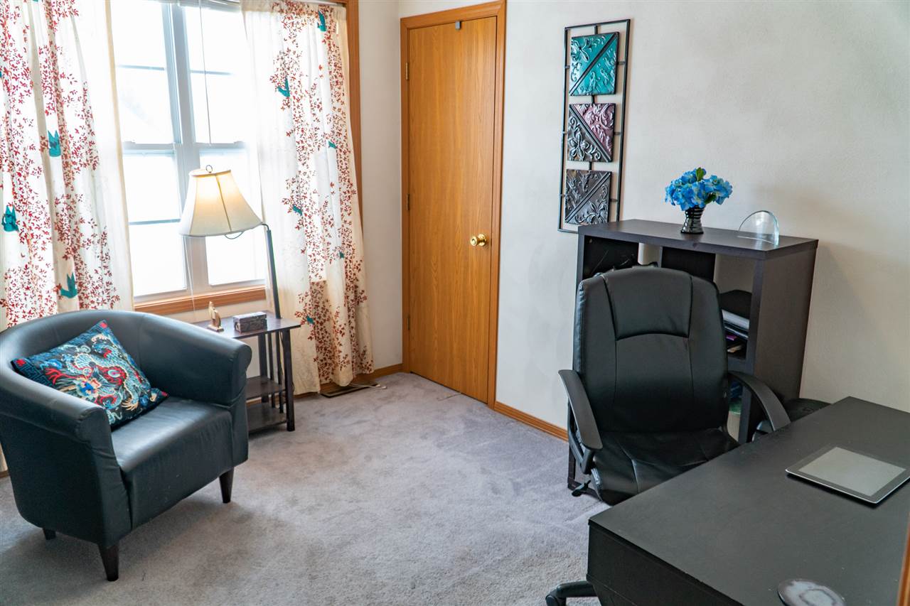 696 Bayfield Road Rockton, IL 61072 - Photo 18 of 20 a living room with furniture and a window