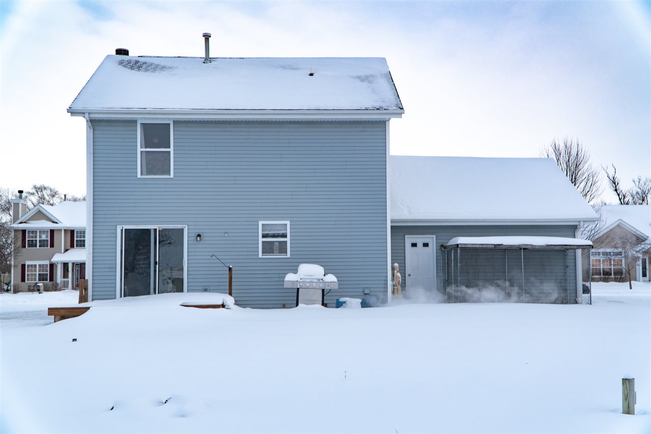 696 Bayfield Road Rockton, IL 61072 - Photo 20 of 20 a bedroom with a bed and a potted plant