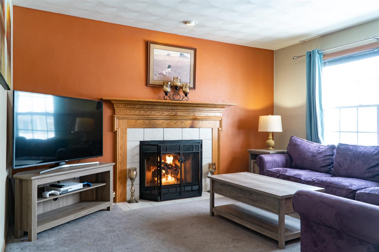 696 Bayfield Road Rockton, IL 61072 - Photo 3 of 20 a living room with furniture and a fireplace
