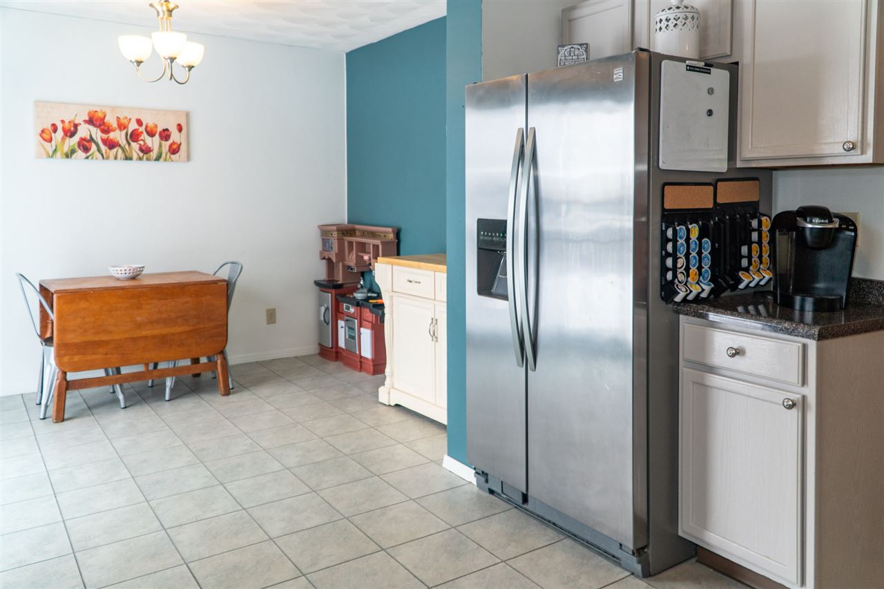 696 Bayfield Road Rockton, IL 61072 - Photo 8 of 20 a kitchen with stainless steel appliances granite countertop a refrigerator and a stove top oven