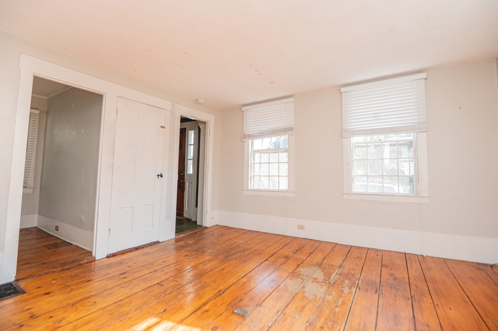 6 Merritt Street Marblehead, MA 01945 - Photo 12 of 31 a view of empty room with wooden floor and fan