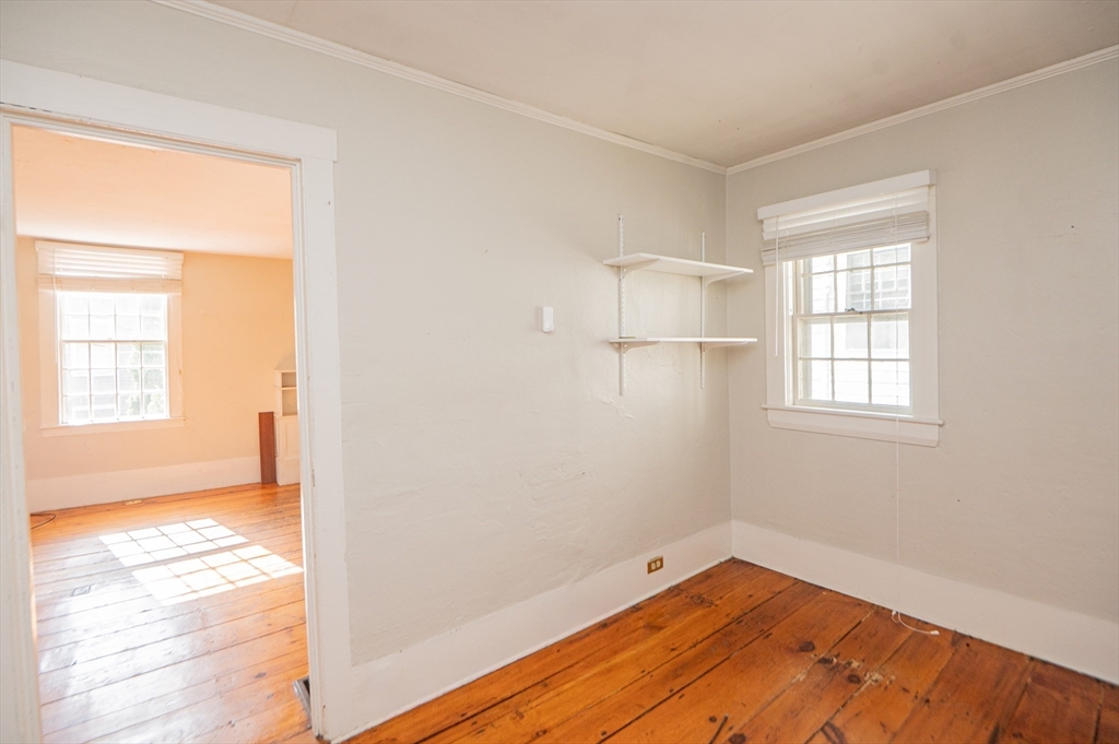 6 Merritt Street Marblehead, MA 01945 - Photo 13 of 31 a view of empty room with wooden floor and fan