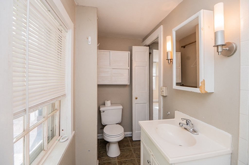 6 Merritt Street Marblehead, MA 01945 - Photo 16 of 31 a bathroom with a sink a toilet and shower