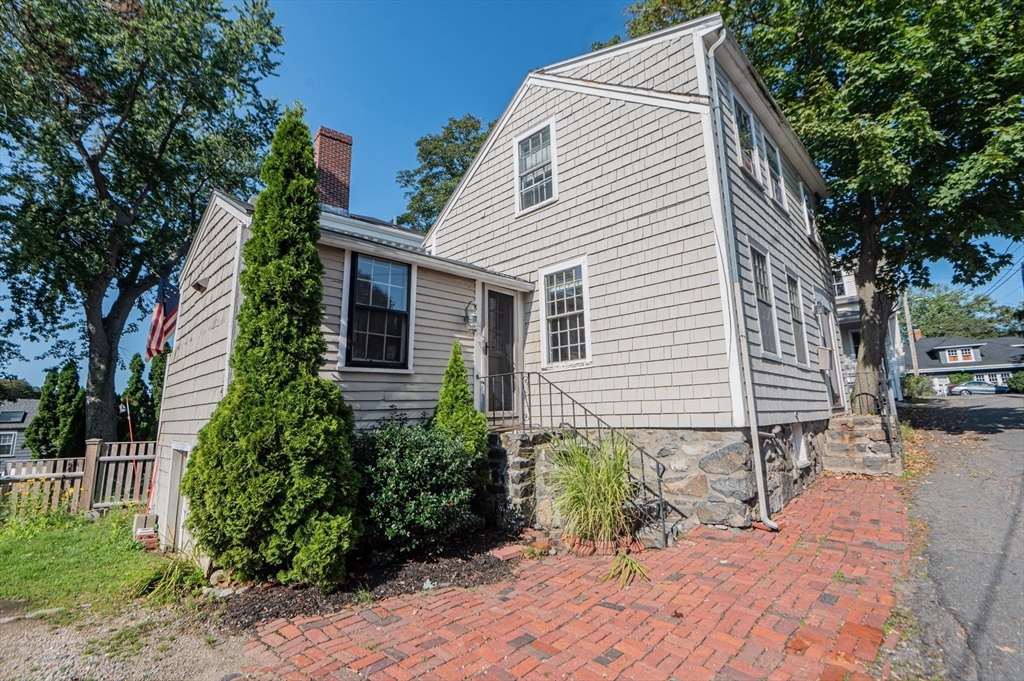 6 Merritt Street Marblehead, MA 01945 - Photo 27 of 31 a view of backyard with a chair and potted plants