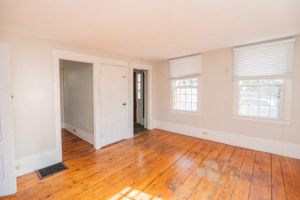6 Merritt Street Marblehead, MA 01945 - Photo 6 of 31 a view of an empty room with wooden floor and a window
