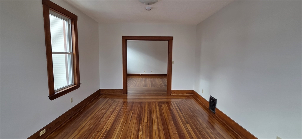 25 Bennett Street, Unit 2 Beverly, MA 01915 - Photo 16 of 17 a view of wooden floor in an empty room
