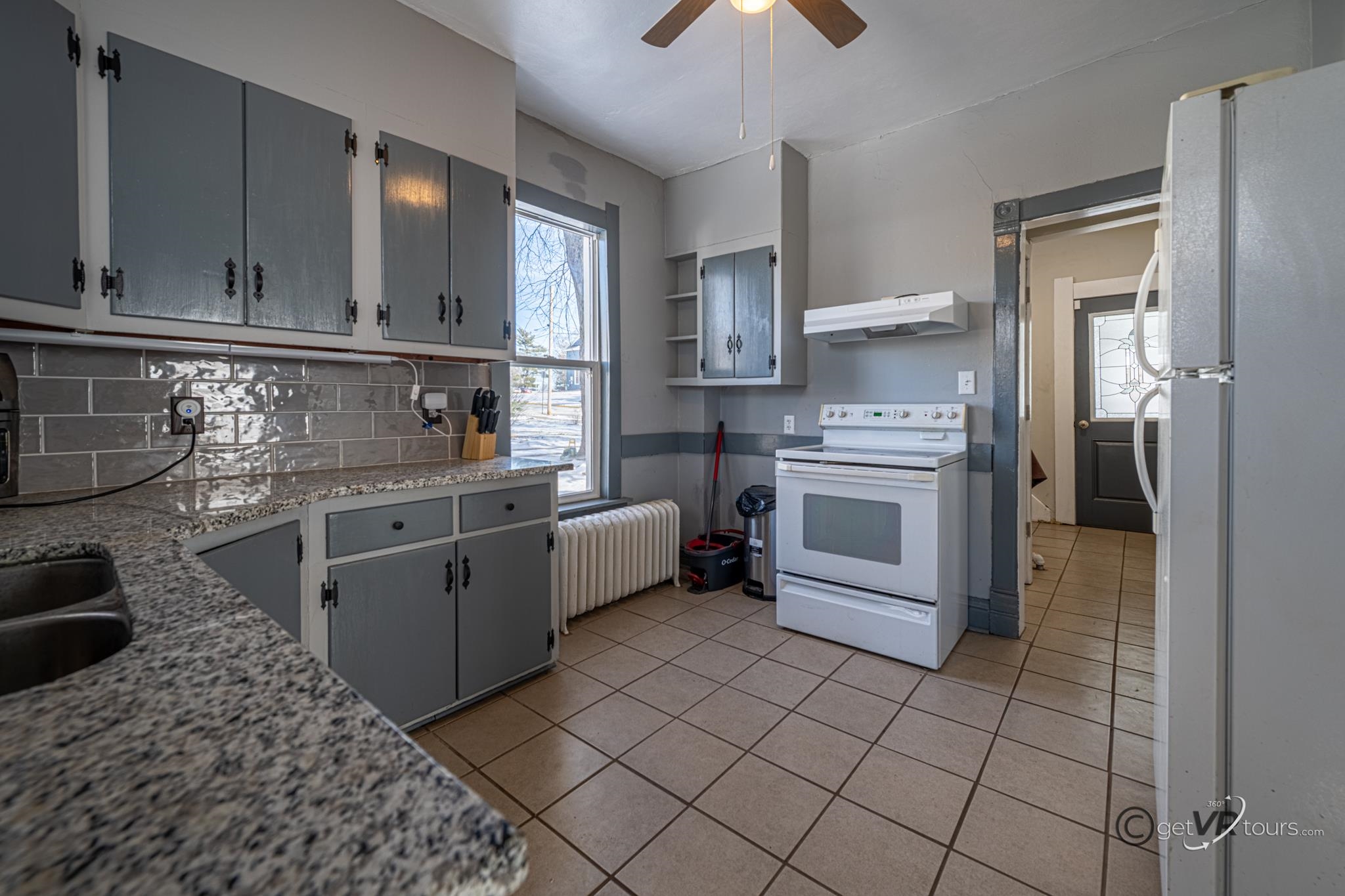 520 South Burchard Avenue Freeport, IL 61032 - Photo 8 of 25 a kitchen with stainless steel appliances granite countertop a stove a sink and a refrigerator