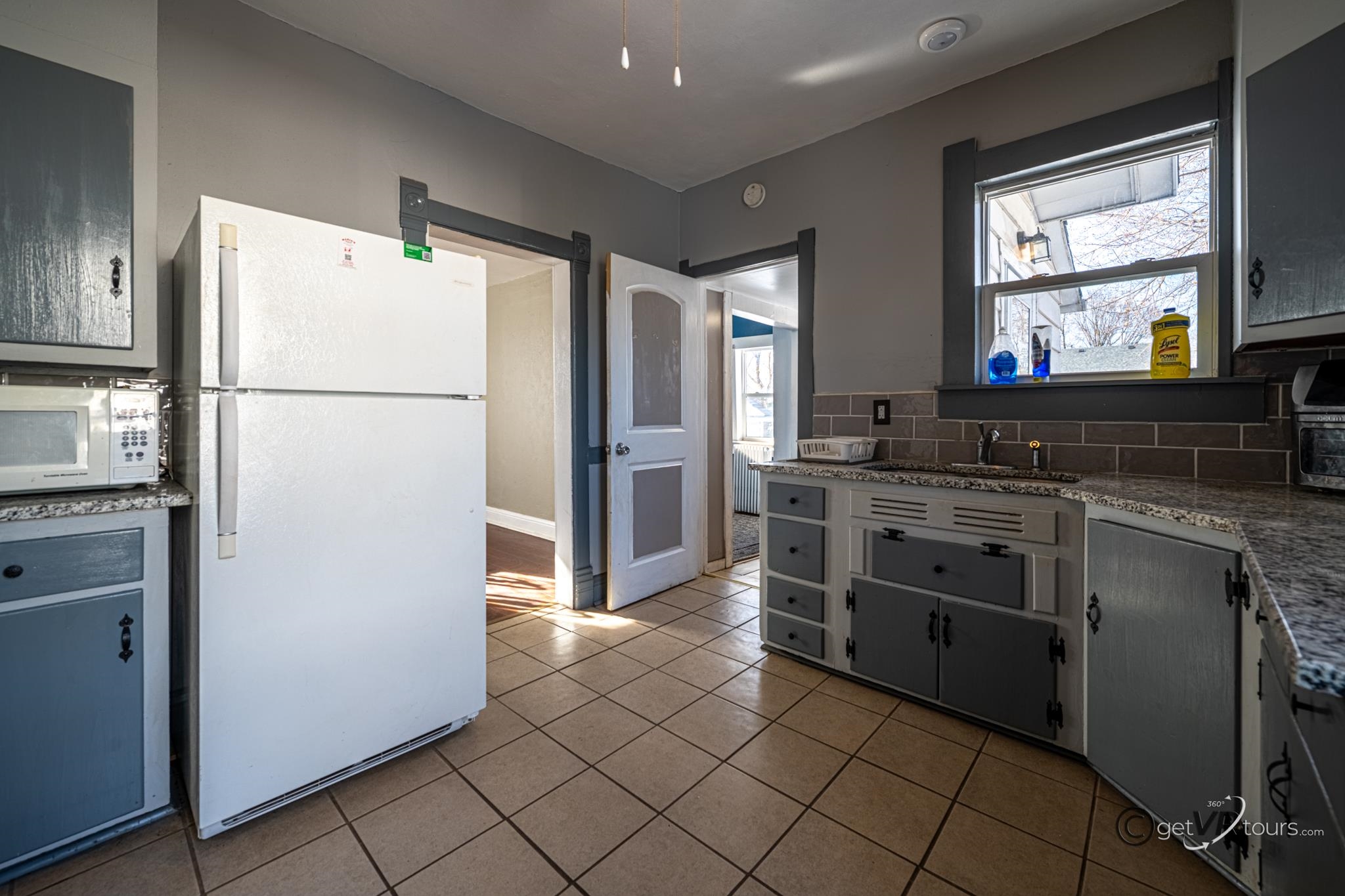 520 South Burchard Avenue Freeport, IL 61032 - Photo 9 of 25 a kitchen with stainless steel appliances a refrigerator sink and microwave