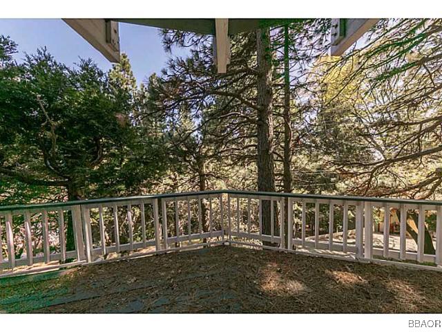 26652 Valley View Lake Rimforest, CA 92378 - Photo 11 of 17 a view of a yard with wooden fence