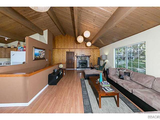 26652 Valley View Lake Rimforest, CA 92378 - Photo 4 of 17 a living room with furniture a large window and a chandelier