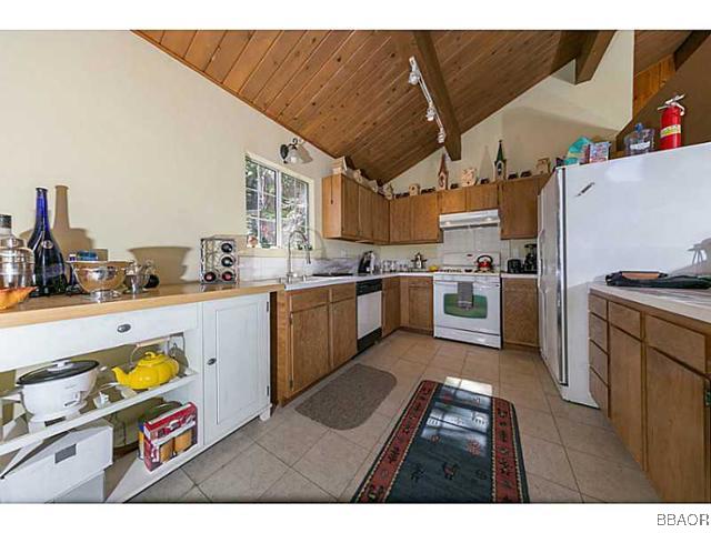 26652 Valley View Lake Rimforest, CA 92378 - Photo 6 of 17 a kitchen with cabinets a sink and appliances