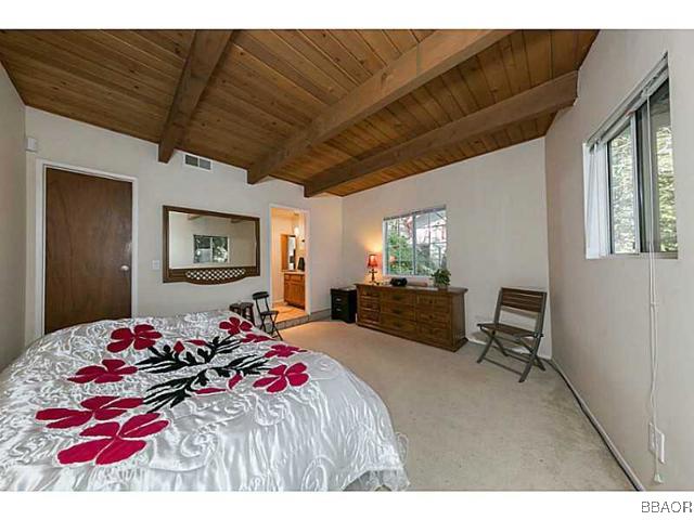 26652 Valley View Lake Rimforest, CA 92378 - Photo 7 of 17 a bedroom with a bed and furniture