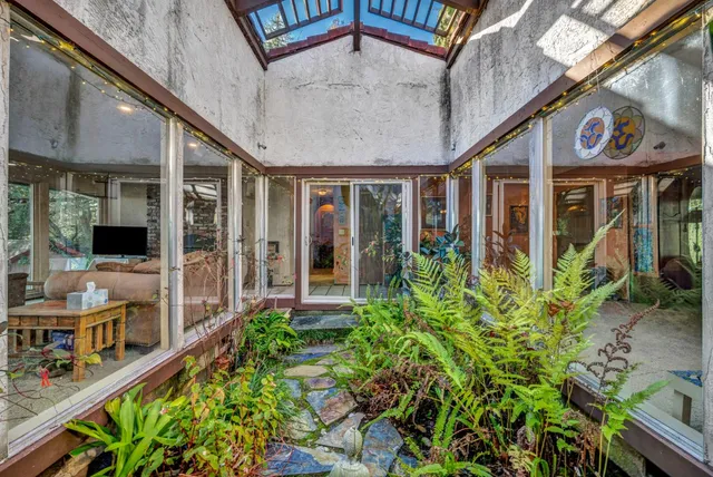 a view of a balcony with lake view and a floor to ceiling window