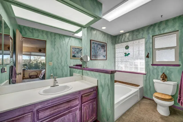 a view of a patio with table and chairs and potted plants
