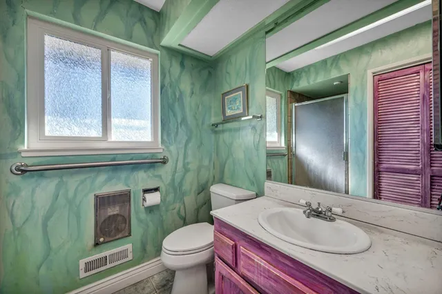 a backyard of a house with outdoor seating