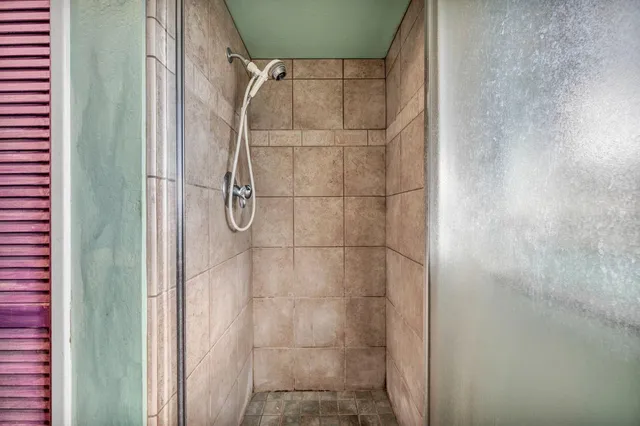 a view of a patio with table and chairs and potted plants