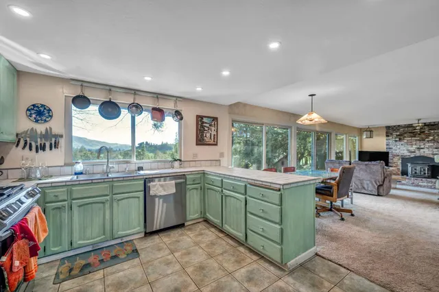 a living room with furniture a rug and a fireplace