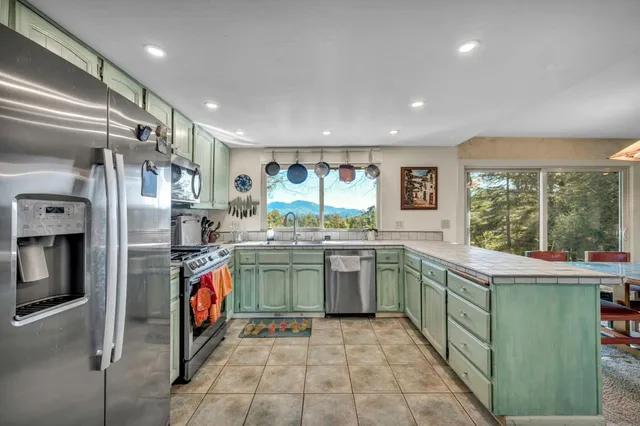 a kitchen with lots of counter space and window