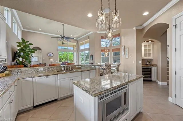 a kitchen with stainless steel appliances granite countertop a sink and stove