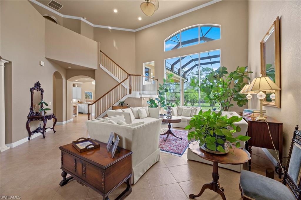 19260 La Serena Drive Estero, FL 33967 - Photo 12 of 48 a living room with furniture and a potted plant