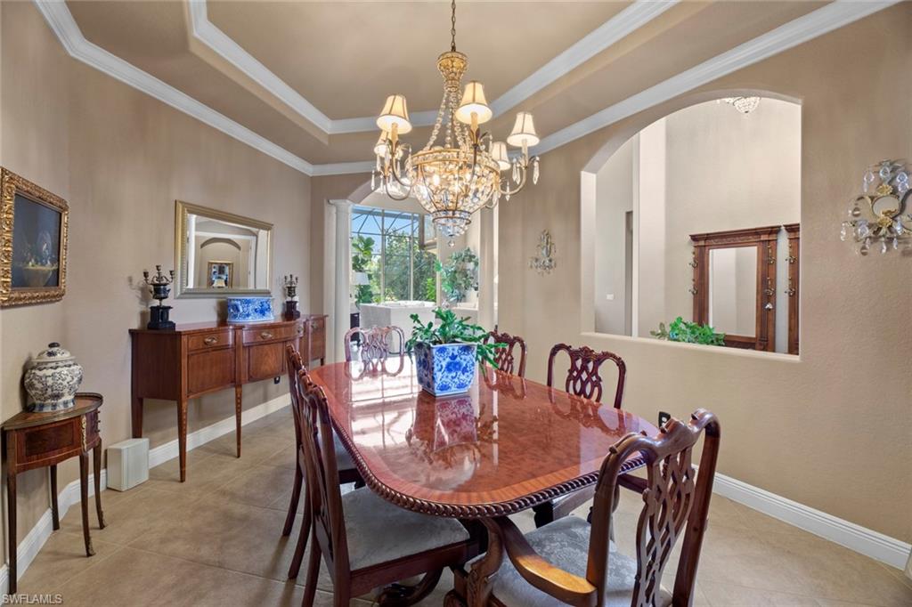 19260 La Serena Drive Estero, FL 33967 - Photo 15 of 48 a view of a dining room with furniture and a chandelier