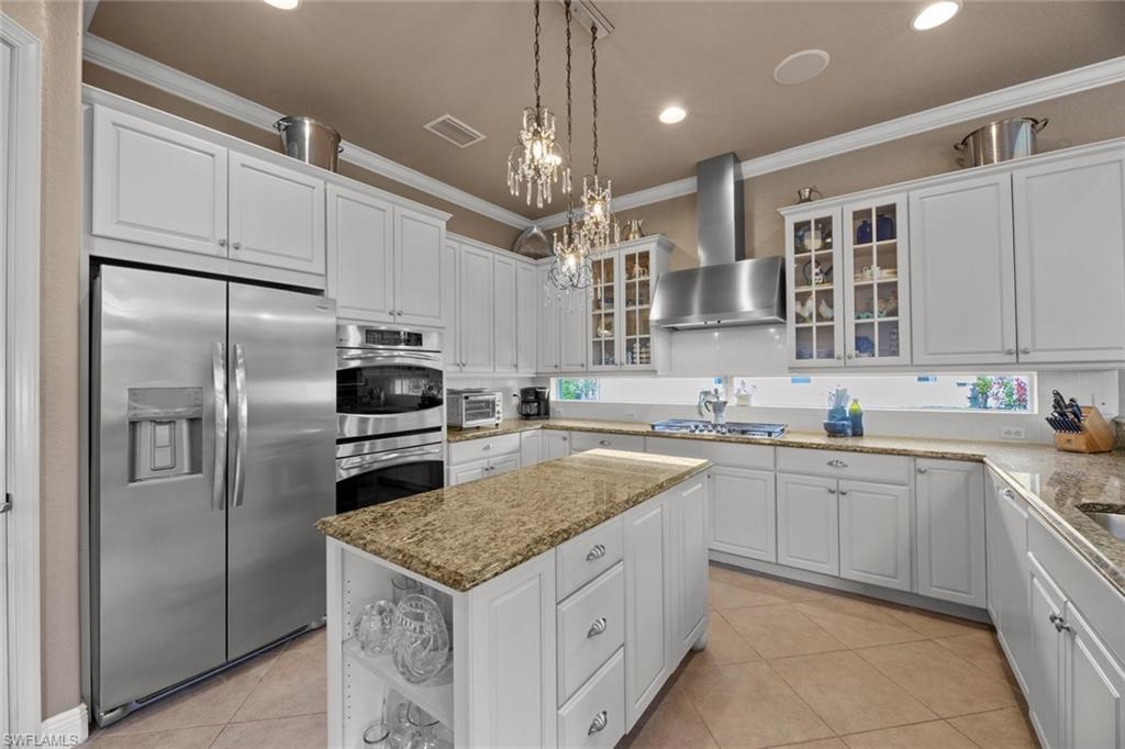 19260 La Serena Drive Estero, FL 33967 - Photo 20 of 48 a kitchen with granite countertop a sink stainless steel appliances and cabinets