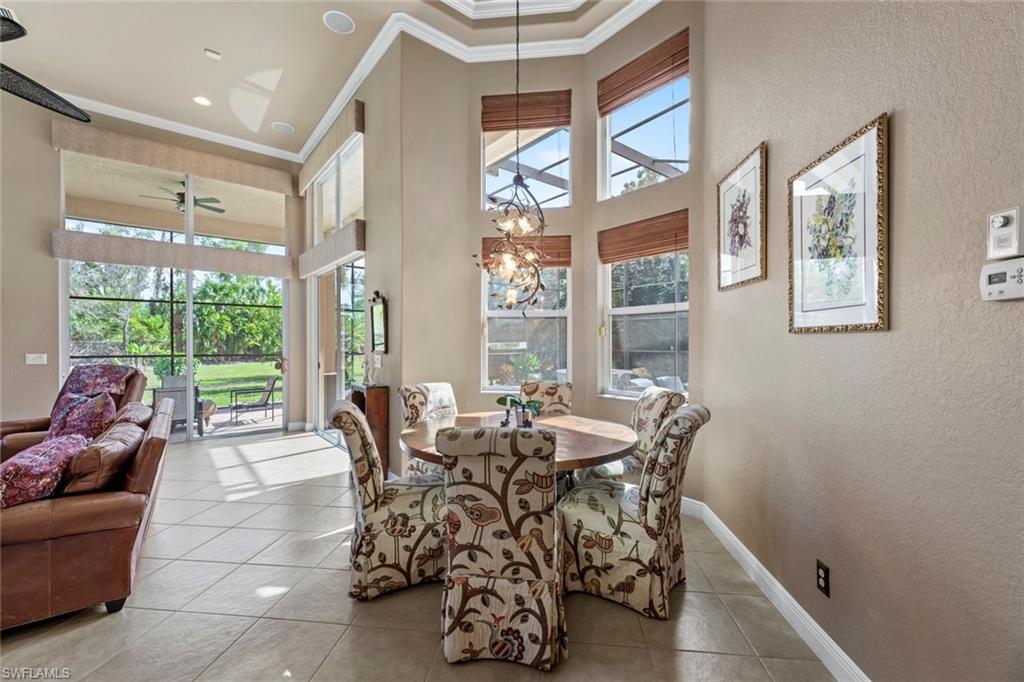 19260 La Serena Drive Estero, FL 33967 - Photo 22 of 48 a dining room with furniture and large windows