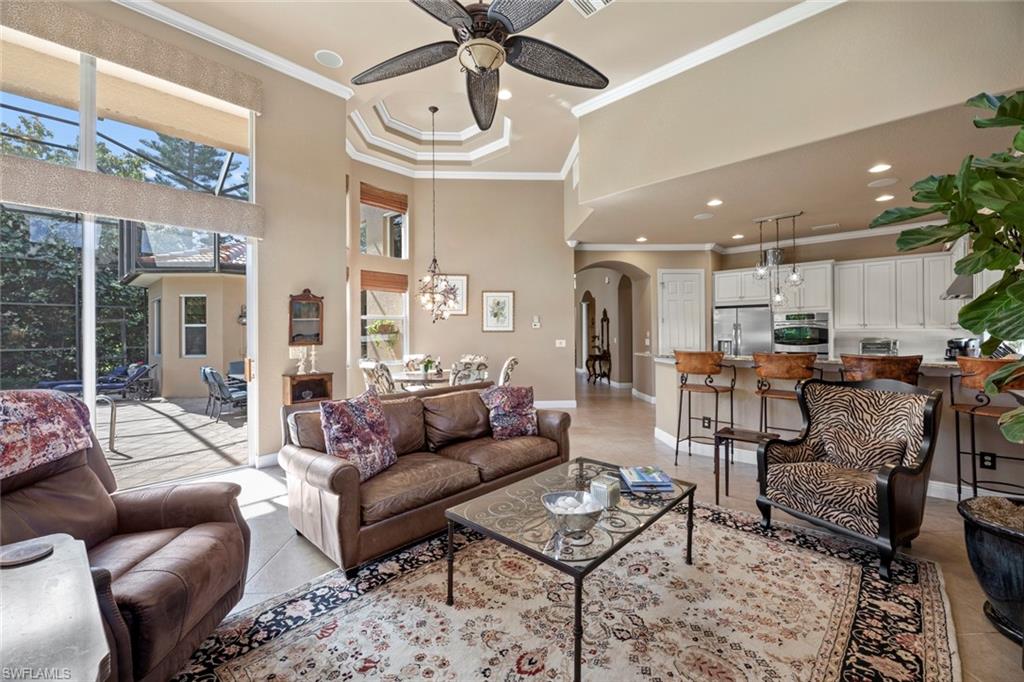 19260 La Serena Drive Estero, FL 33967 - Photo 25 of 48 a living room with furniture kitchen view and a chandelier