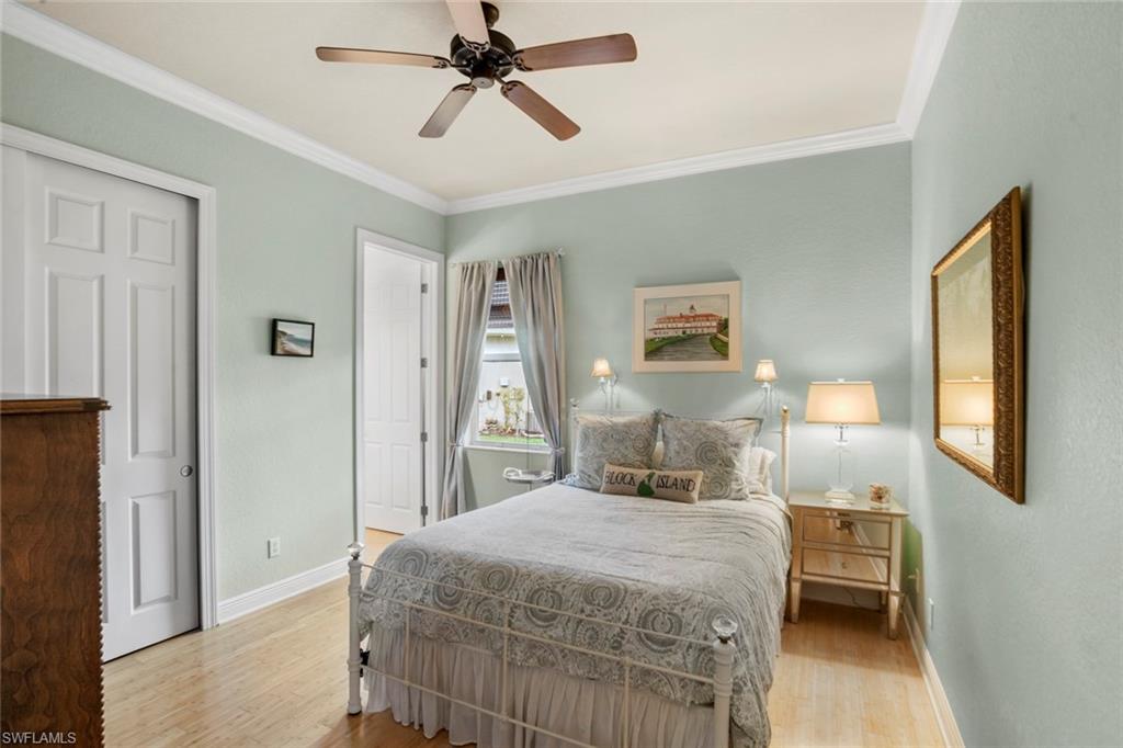 19260 La Serena Drive Estero, FL 33967 - Photo 30 of 48 a bedroom with a bed and a chandelier