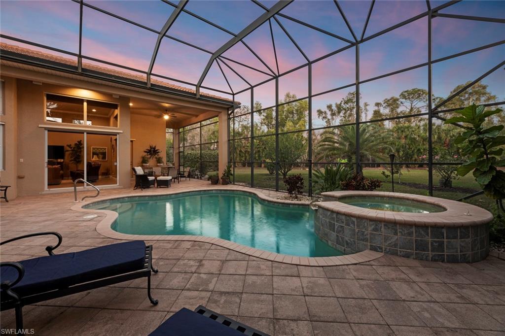 19260 La Serena Drive Estero, FL 33967 - Photo 3 of 48 a view of a swimming pool with a patio