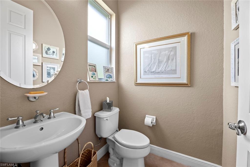 19260 La Serena Drive Estero, FL 33967 - Photo 32 of 48 a bathroom with a toilet a sink and mirror