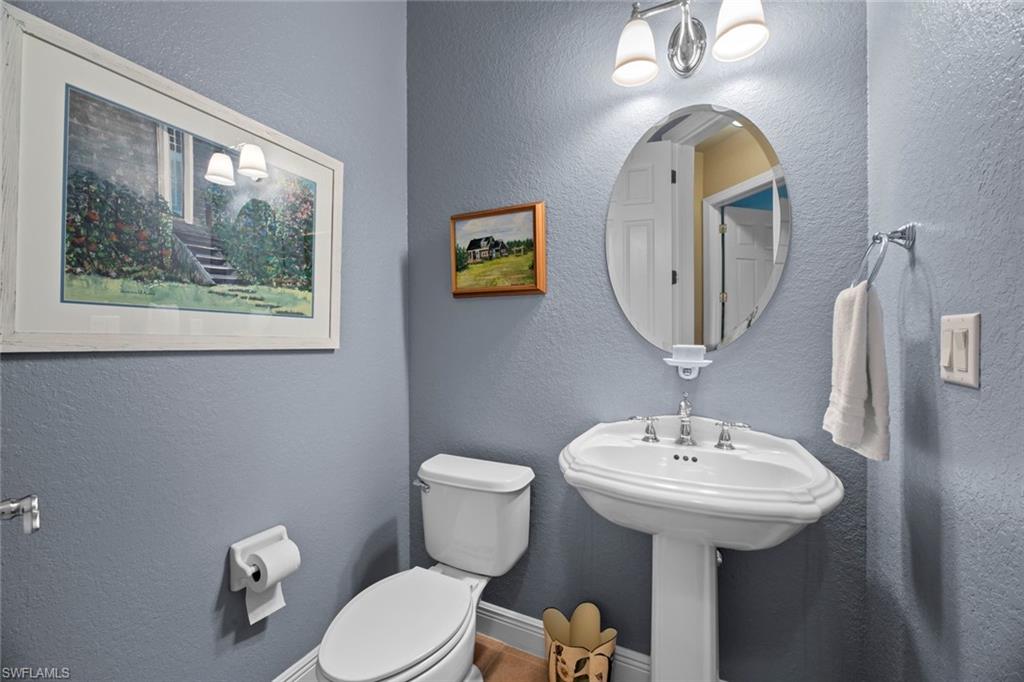 19260 La Serena Drive Estero, FL 33967 - Photo 32 of 48 a bathroom with a toilet sink and mirror
