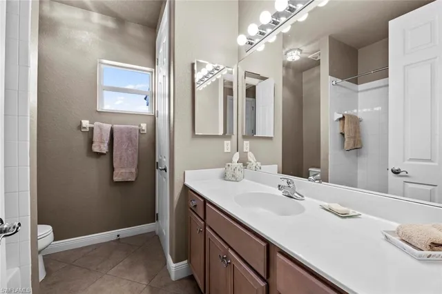 a bathroom with a sink vanity and mirror