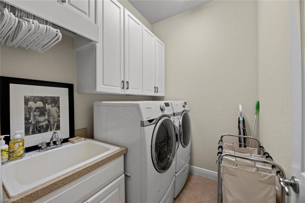 19260 La Serena Drive Estero, FL 33967 - Photo 40 of 48 a utility room with dryer and washer