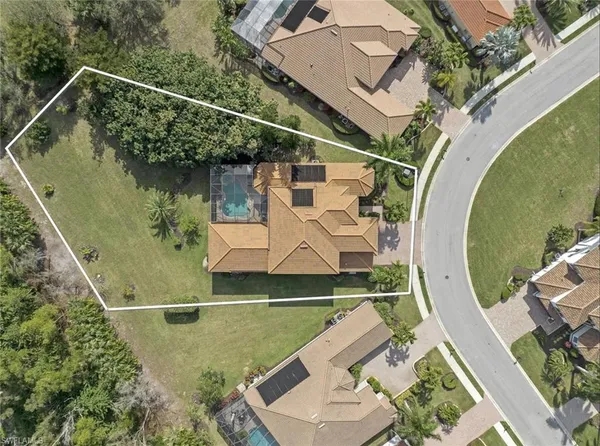 an aerial view of a house with outdoor space