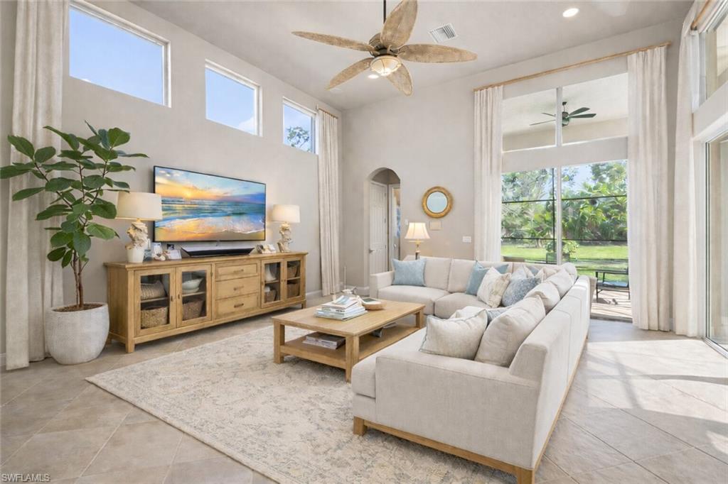 19260 La Serena Drive Estero, FL 33967 - Photo 8 of 48 a living room with furniture and a flat screen tv
