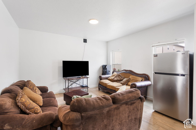 7723 Conger Road Magna, UT 84044 - Photo 12 of 24 Recessed ceiling lighting, light wood-finish flooring, and white painted walls