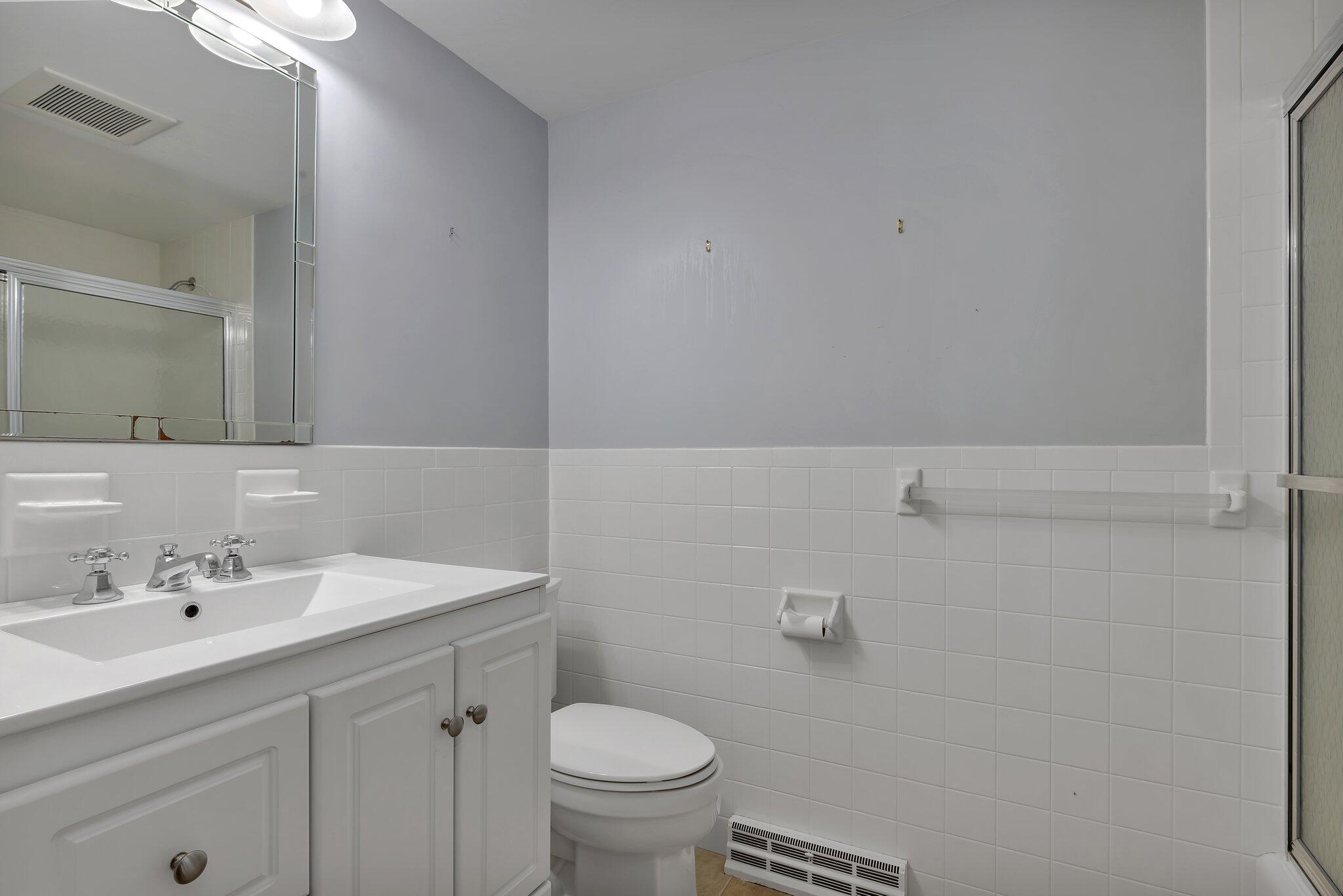 248 Chippingstone Road Chatham, MA 02633 - Photo 16 of 26 a bathroom with a sink toilet and vanity