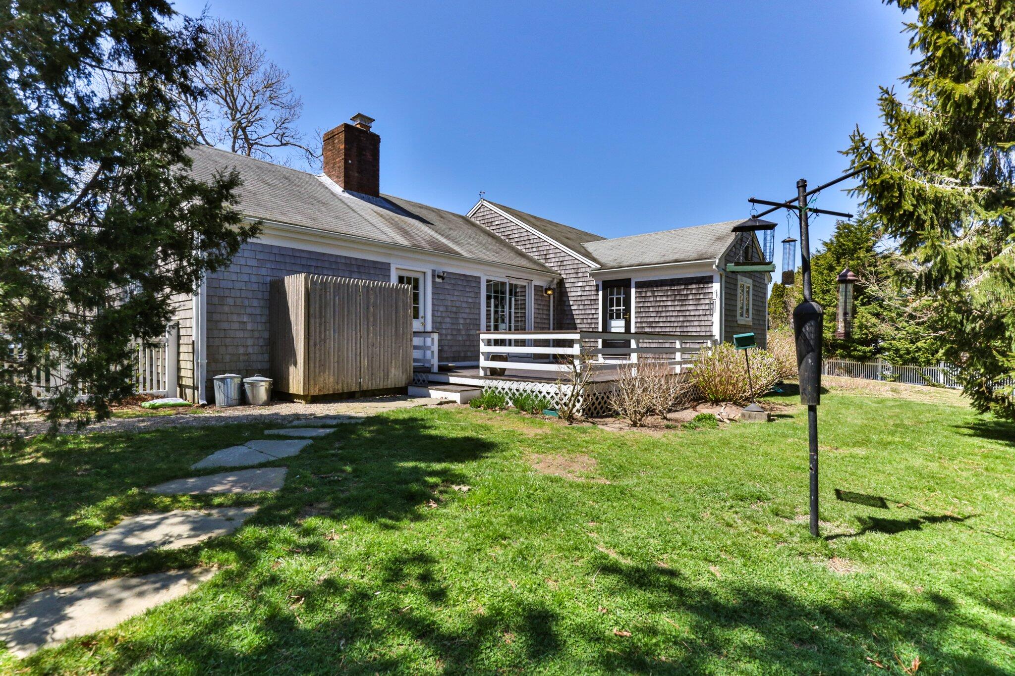 248 Chippingstone Road Chatham, MA 02633 - Photo 18 of 26 a front view of a house with a yard