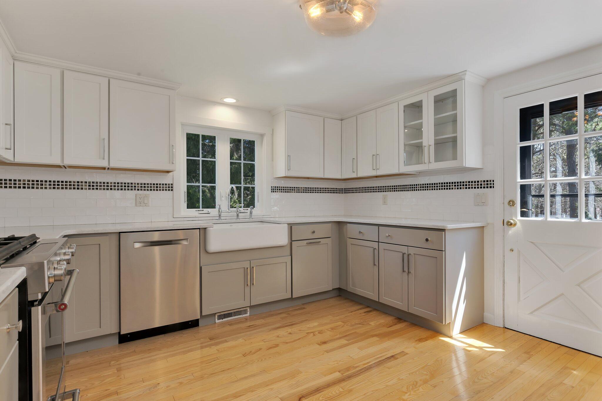 248 Chippingstone Road Chatham, MA 02633 - Photo 8 of 26 a kitchen with granite countertop cabinets stainless steel appliances and a sink