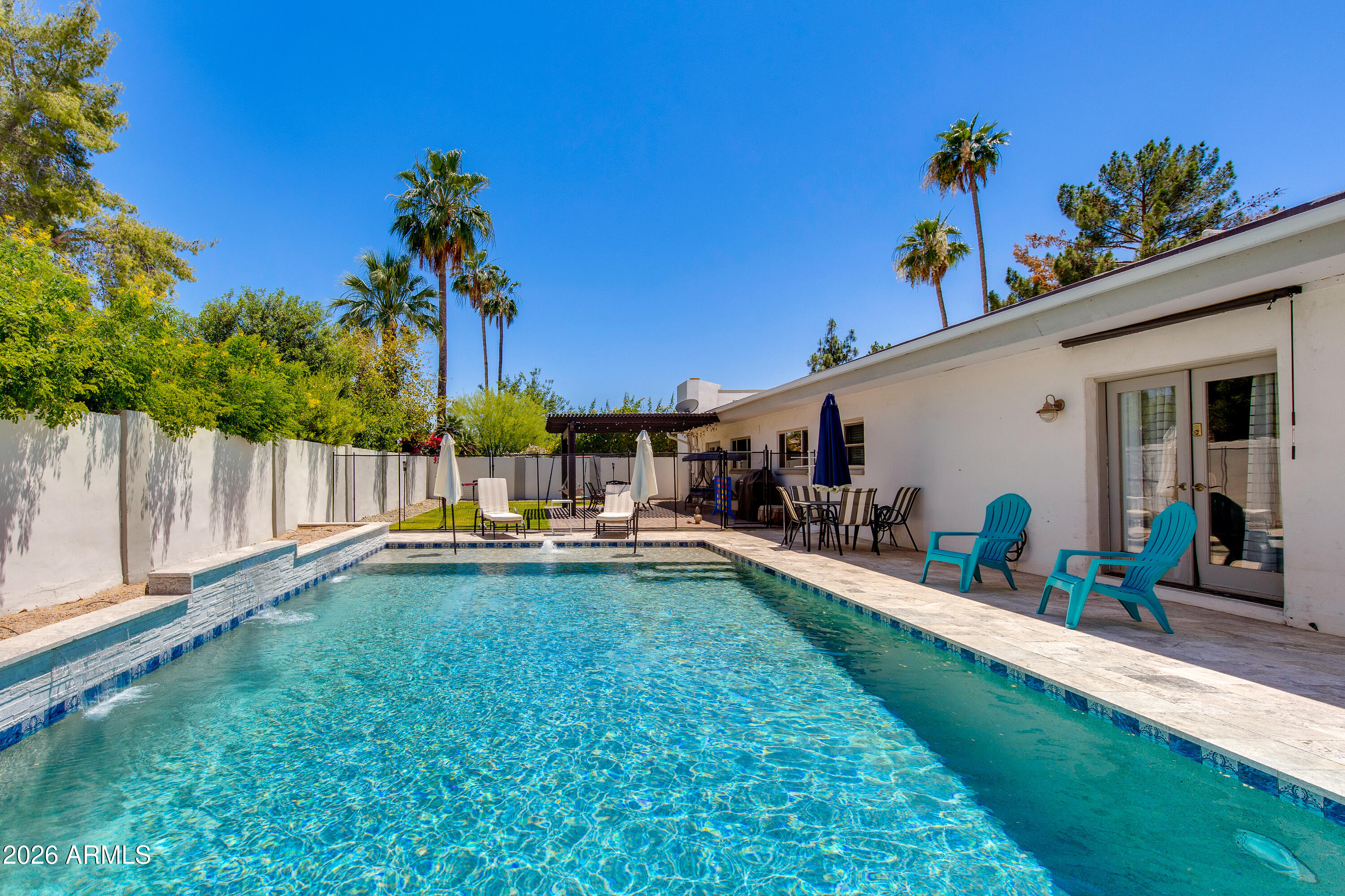 8219 North 3rd Avenue Phoenix, AZ 85021 - Photo 49 of 52 a view of a house with swimming pool and sitting area