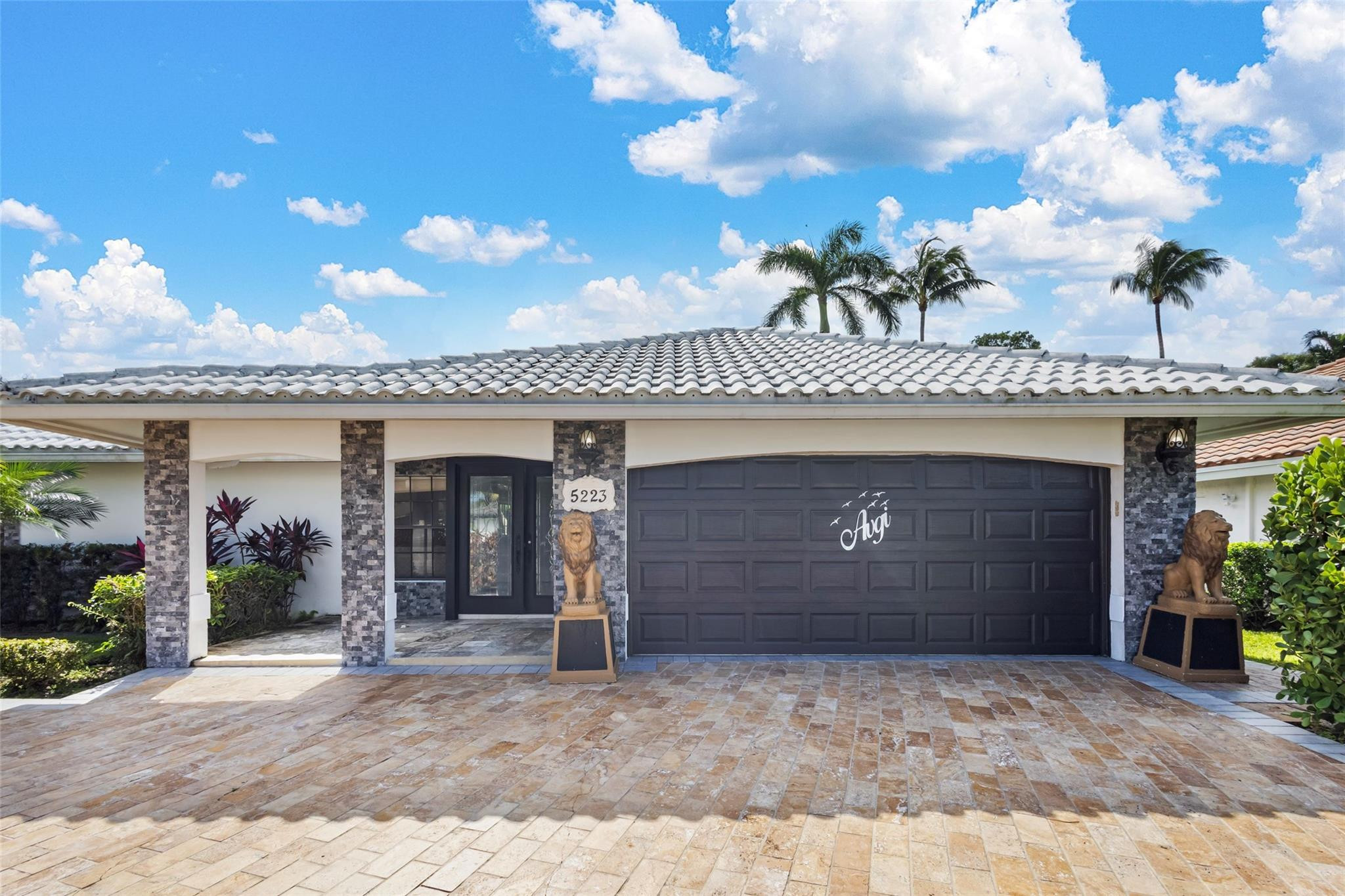 5223 Deerhurst Crescent Circle Boca Raton, FL 33486 - Photo 9 of 51 a view of a building with entryway
