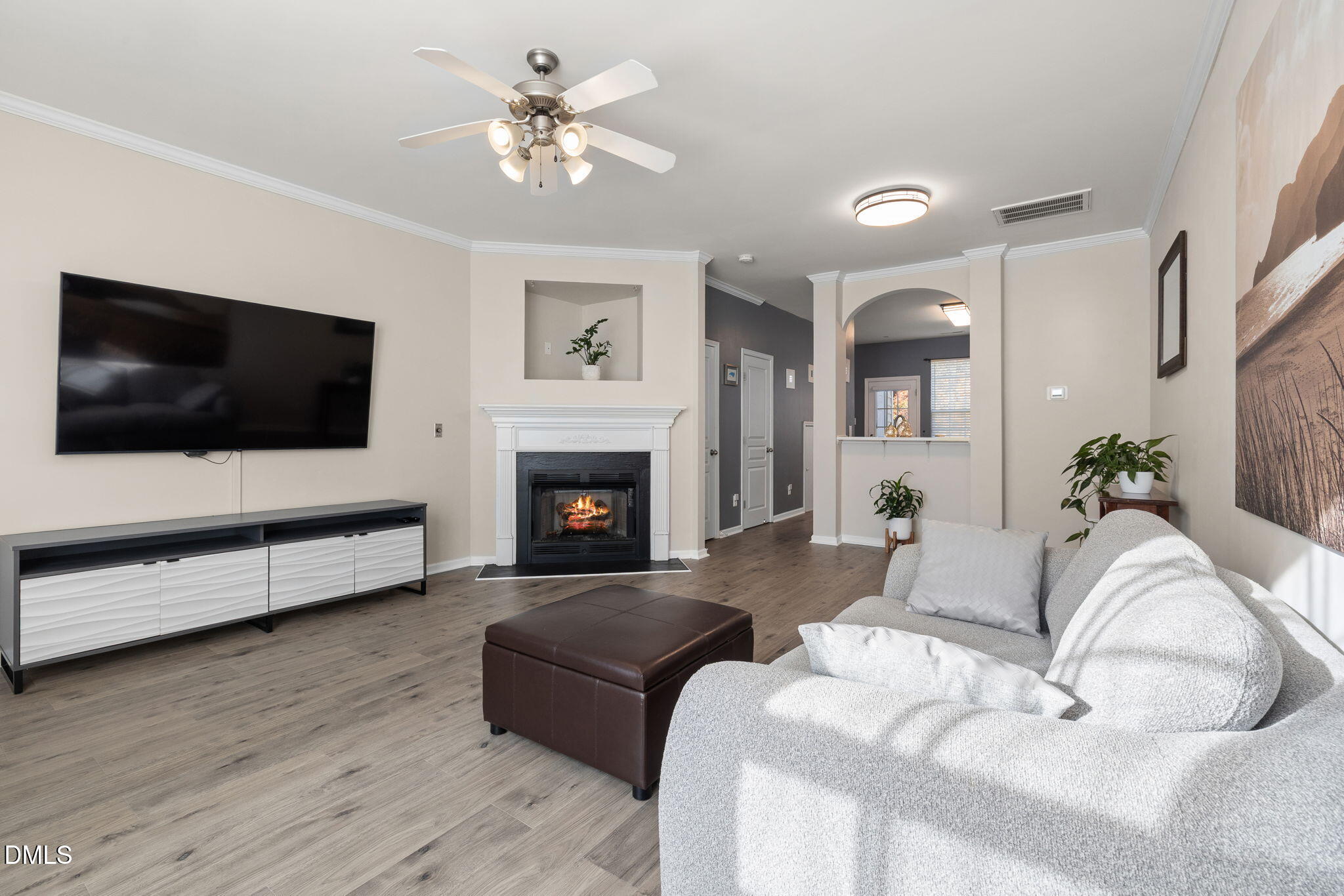 4424 Sugarbend Way Raleigh, NC 27606 - Photo 11 of 38 a living room with furniture fireplace and flat screen tv