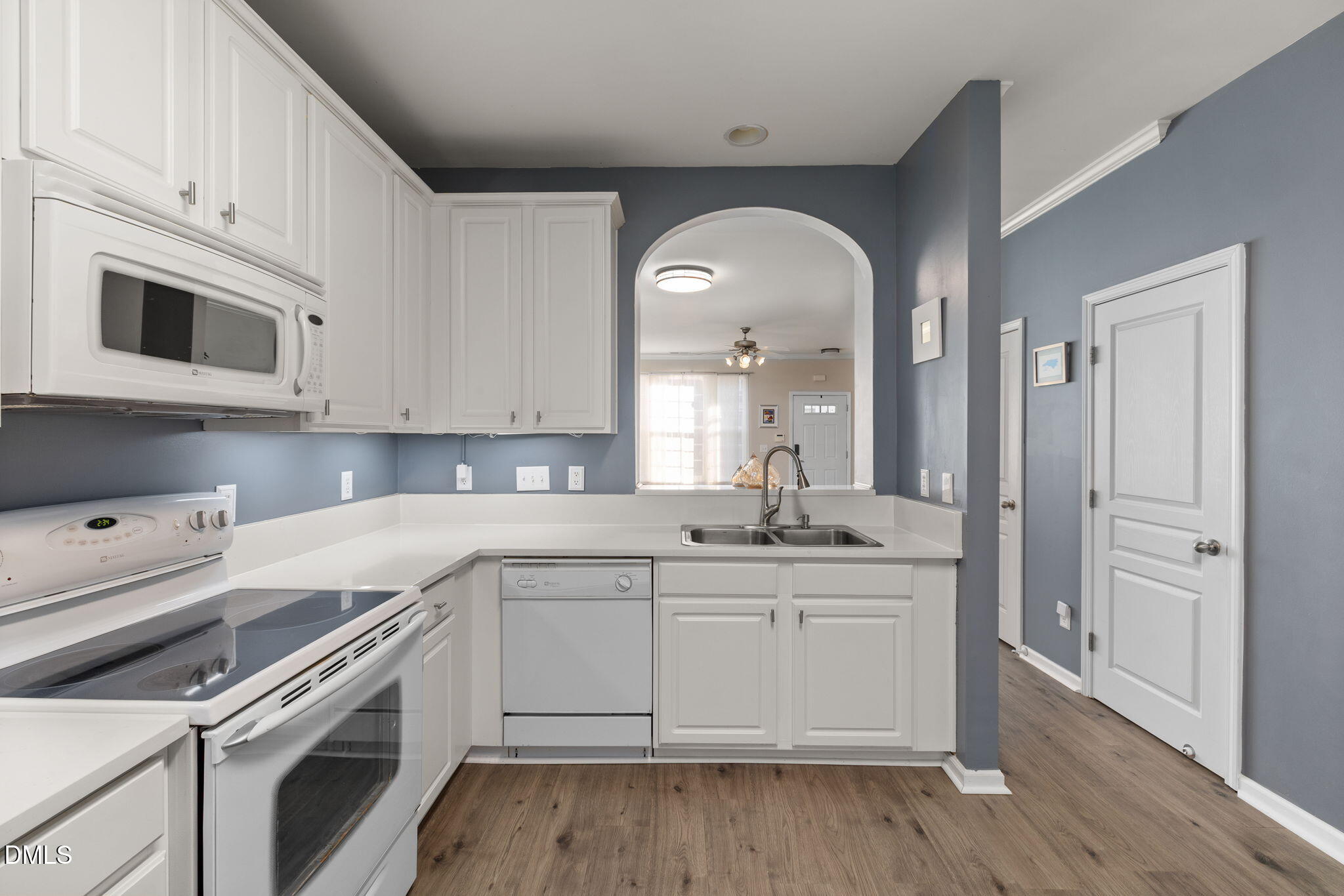 4424 Sugarbend Way Raleigh, NC 27606 - Photo 14 of 38 a kitchen with granite countertop a sink stainless steel appliances and cabinets