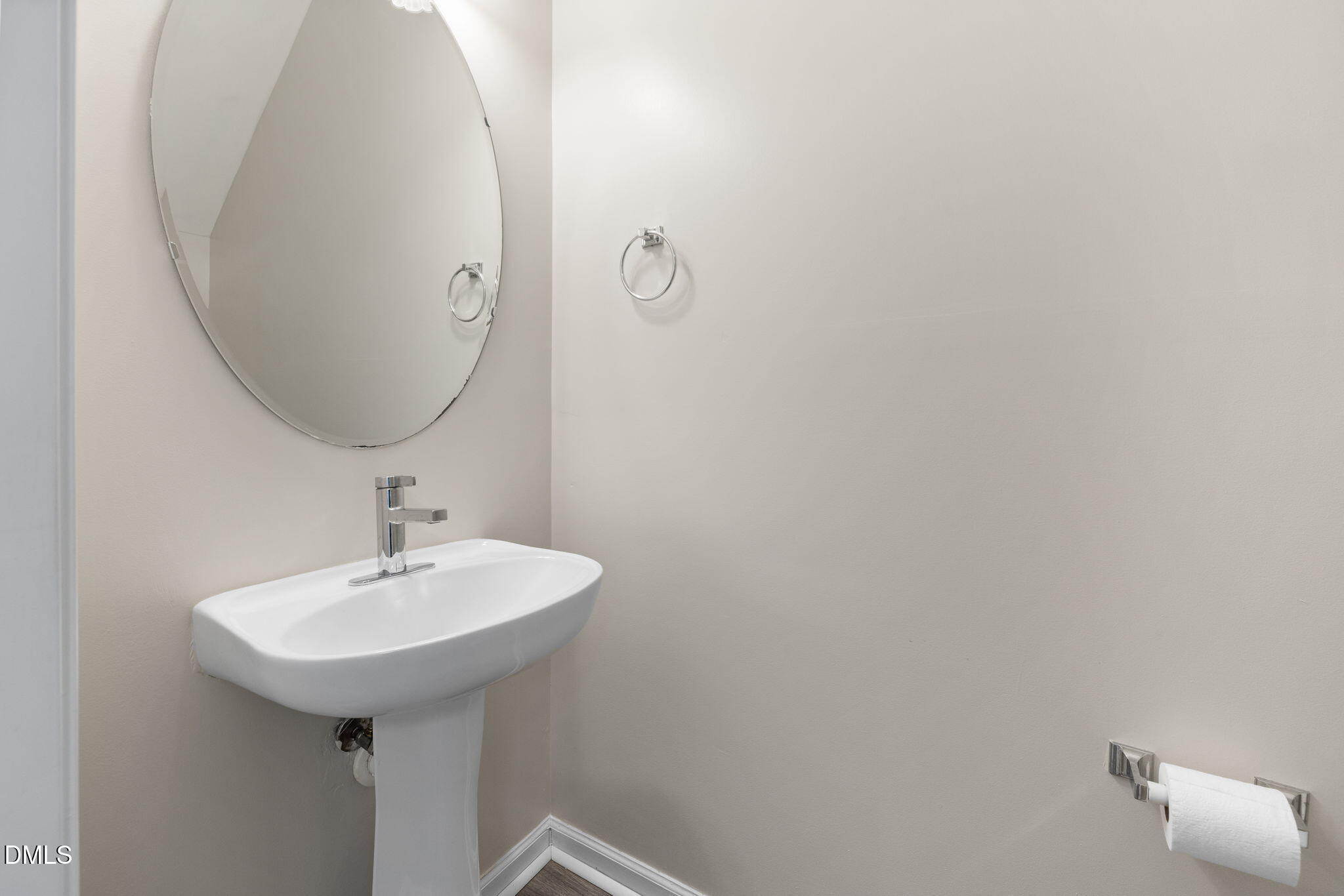 4424 Sugarbend Way Raleigh, NC 27606 - Photo 20 of 38 a bathroom with a sink and mirror