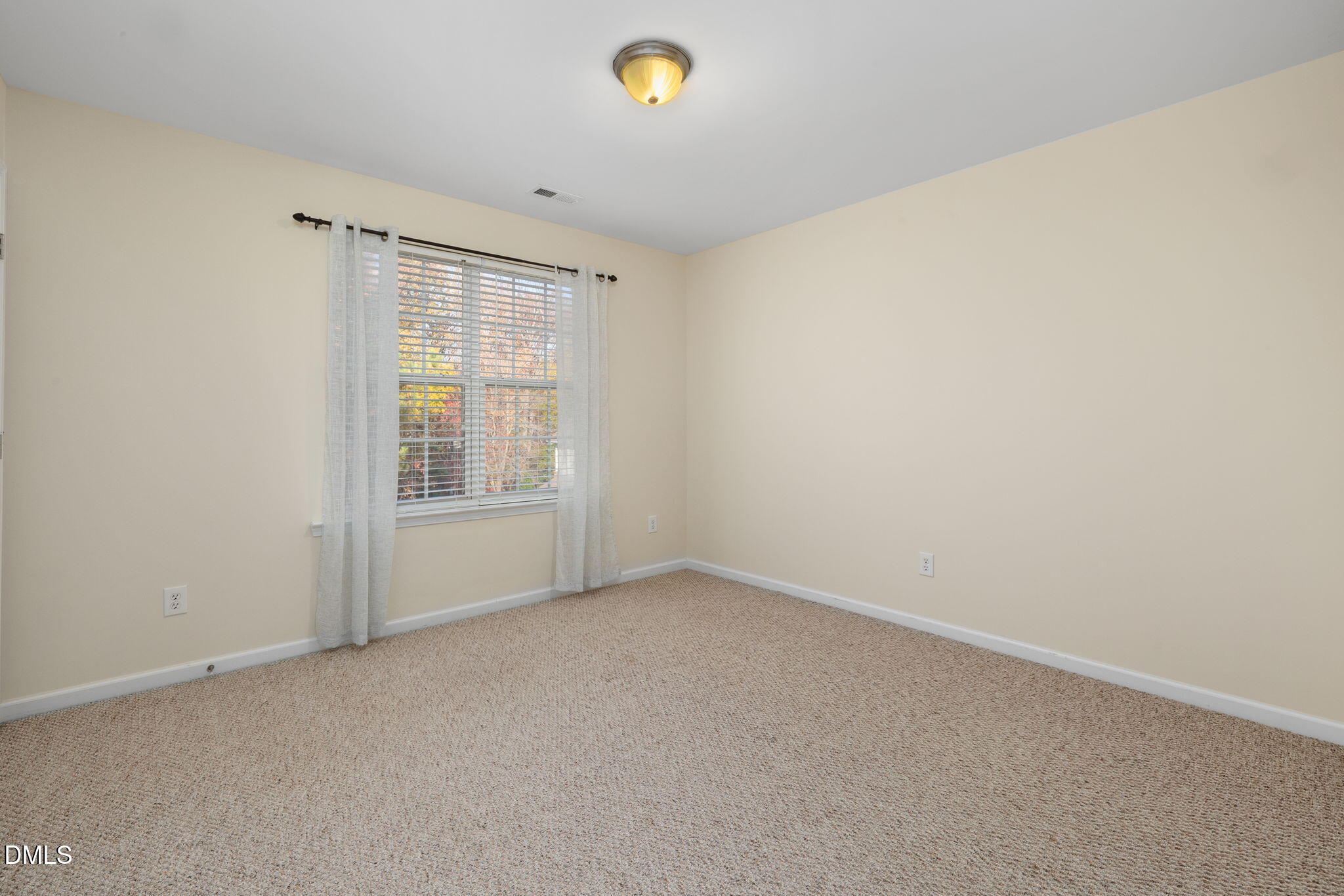 4424 Sugarbend Way Raleigh, NC 27606 - Photo 22 of 38 a view of an empty room with a window